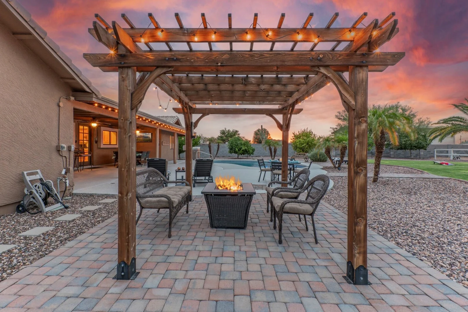 Pergola with fire pit and pool at an Arizona vacation rental