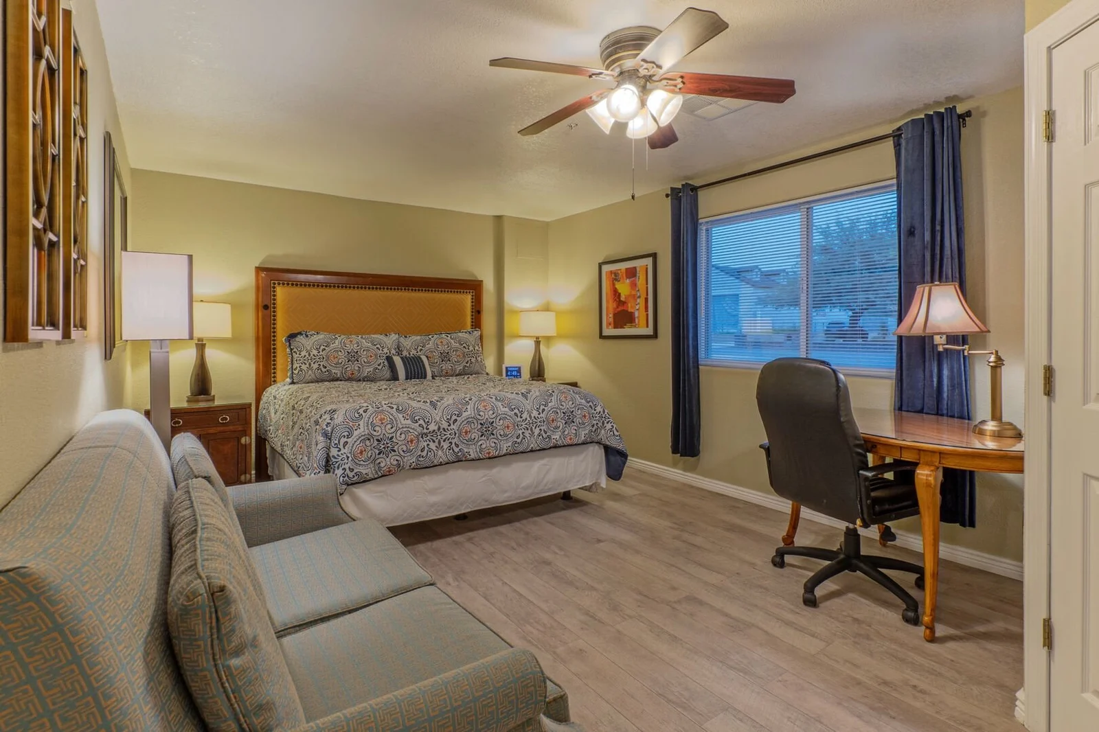 Bedroom with king bed and workspace