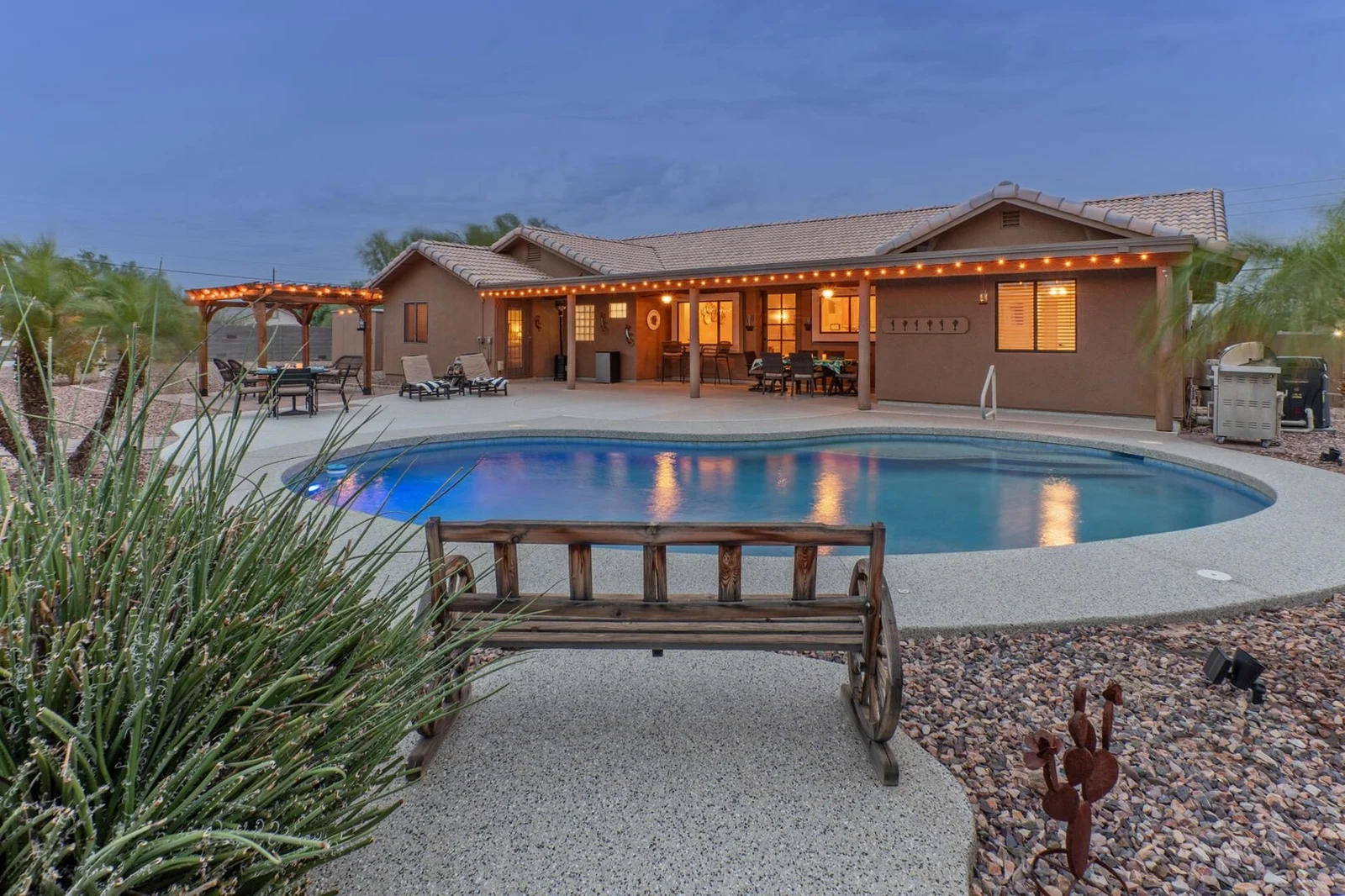 Arizona vacation rental home with pool at dusk